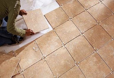 Photo - Laying ceramic tiles on a warm floor