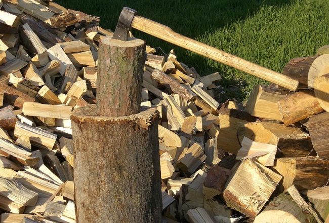 Chopping firewood with an ax