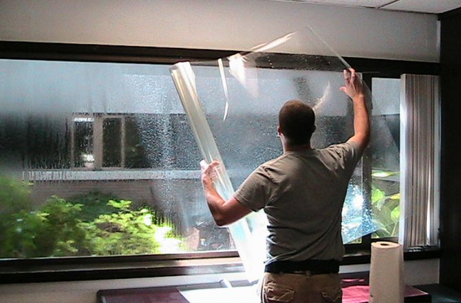 Installation of tint film on double-glazed windows