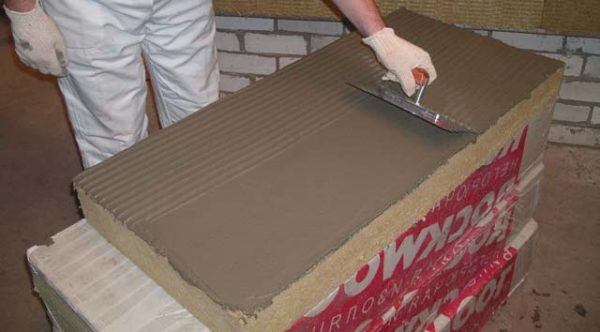 Applying glue to mineral wool