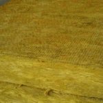 Mineral wool slabs with synthetic binder