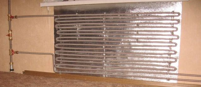 Homemade heating radiator made of corrugated pipes