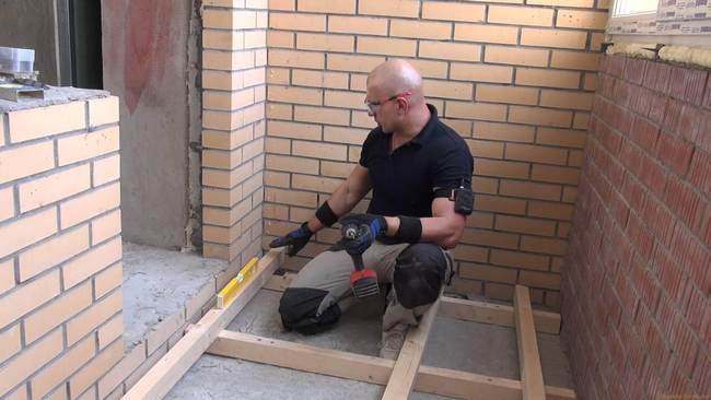 installation of wooden logs on the balcony