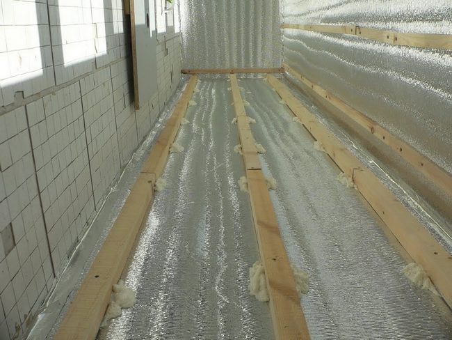 insulation of a wooden floor with foam foam from below