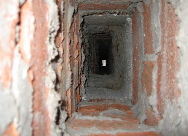 Inner surface of a brick chimney